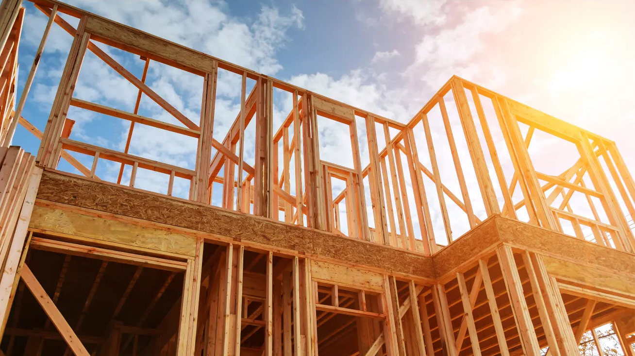Timber frame of a new home at sunset