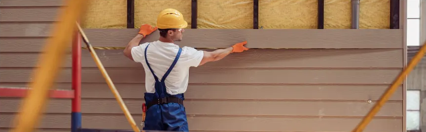 Siding installation on a house wall