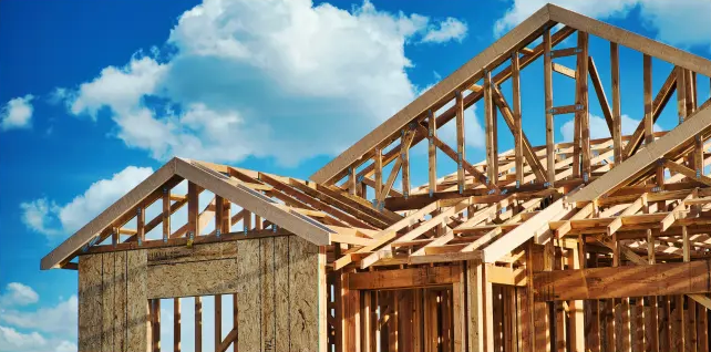 House framing against a blue sky